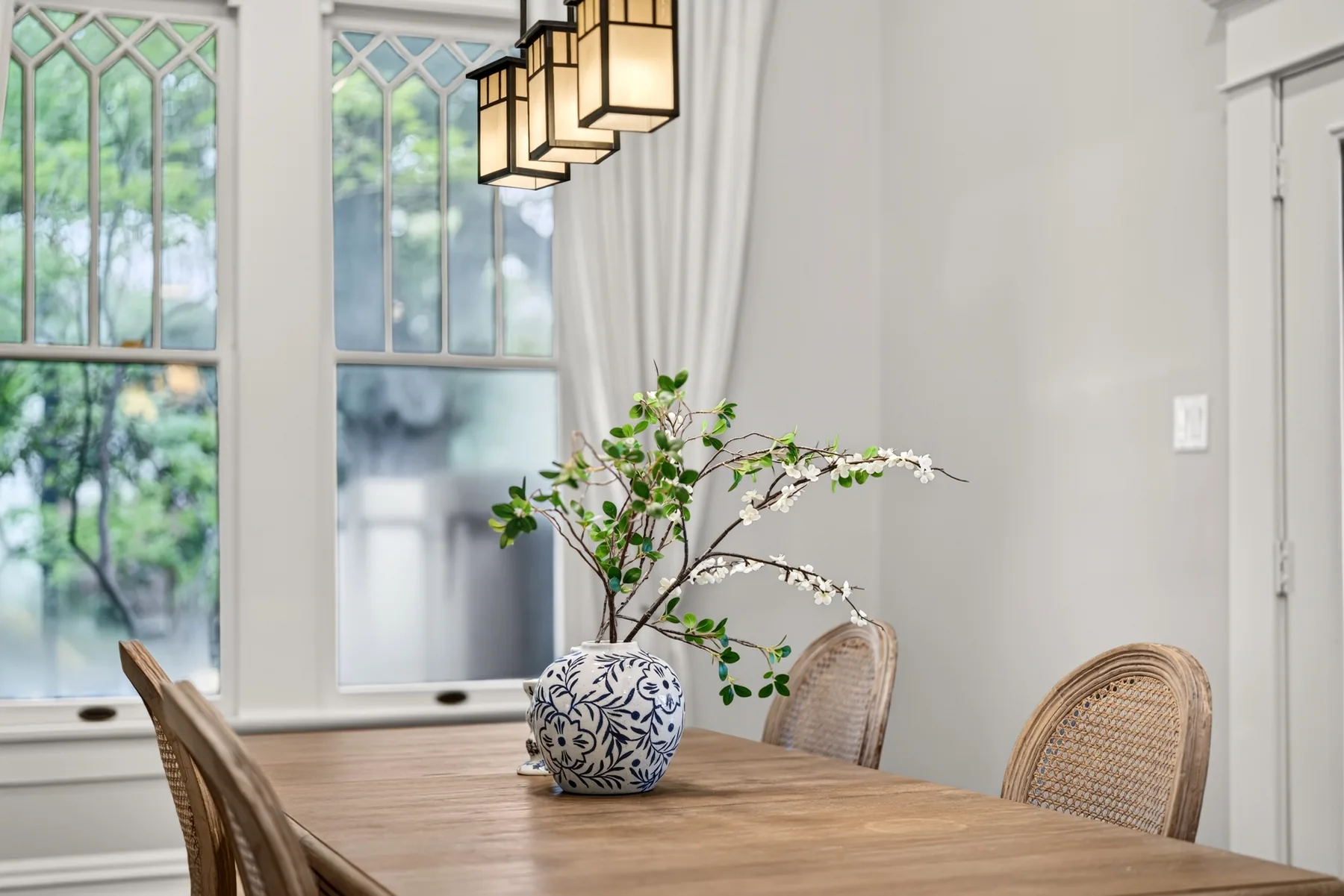 Blue and white vase on a wood dining table