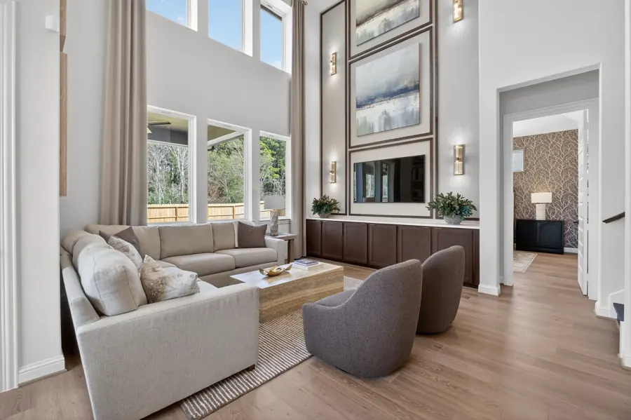 Two-story living room with tall windows