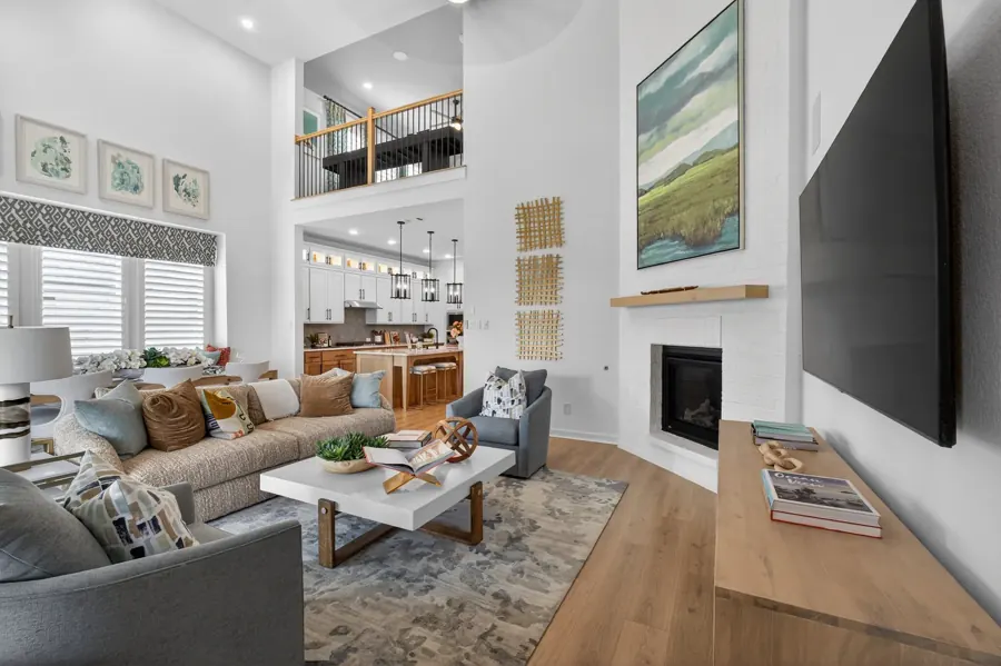 Family room with fireplace and loft view
