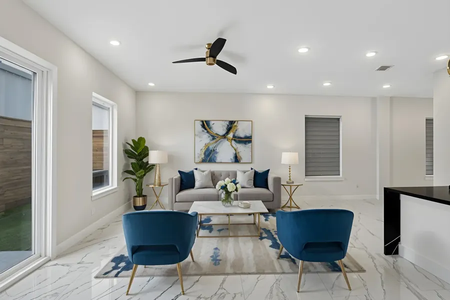 Virtually staged living room with blue chairs